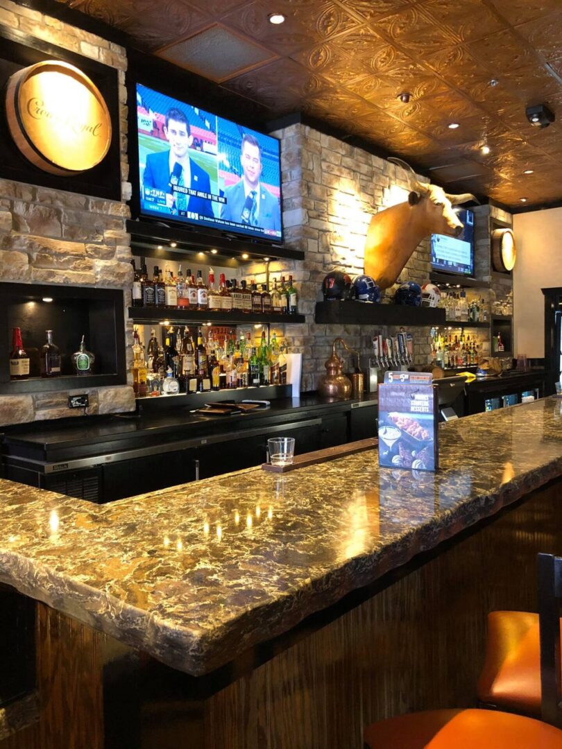 Brown bar countertop and white brick walls