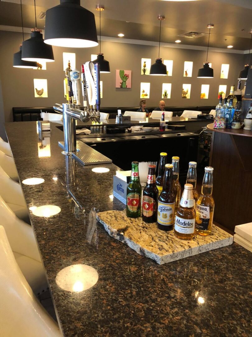 Dark bar countertop with liquor bottles