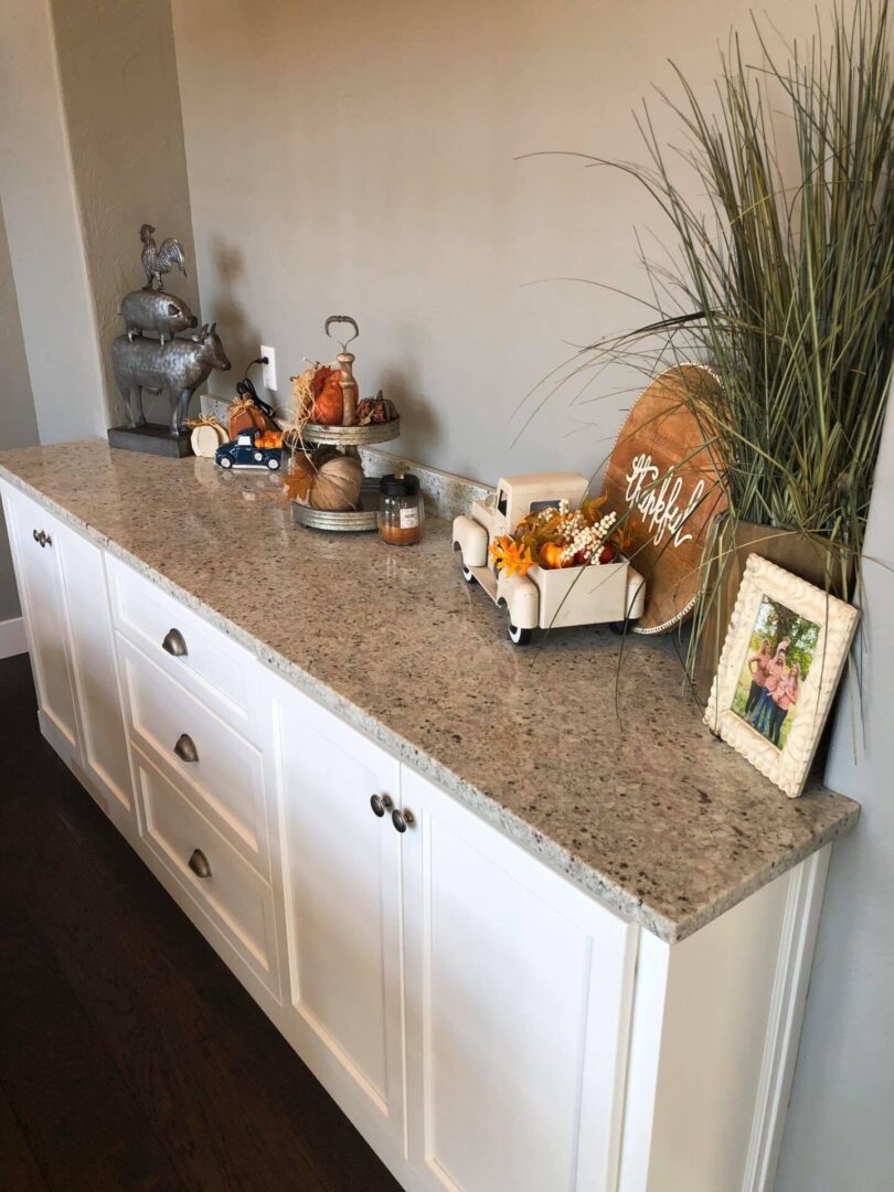 White cabinetry with light gray top